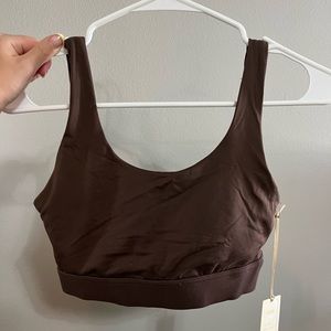 Built in padding, well supported sports bra. New condition with tags.